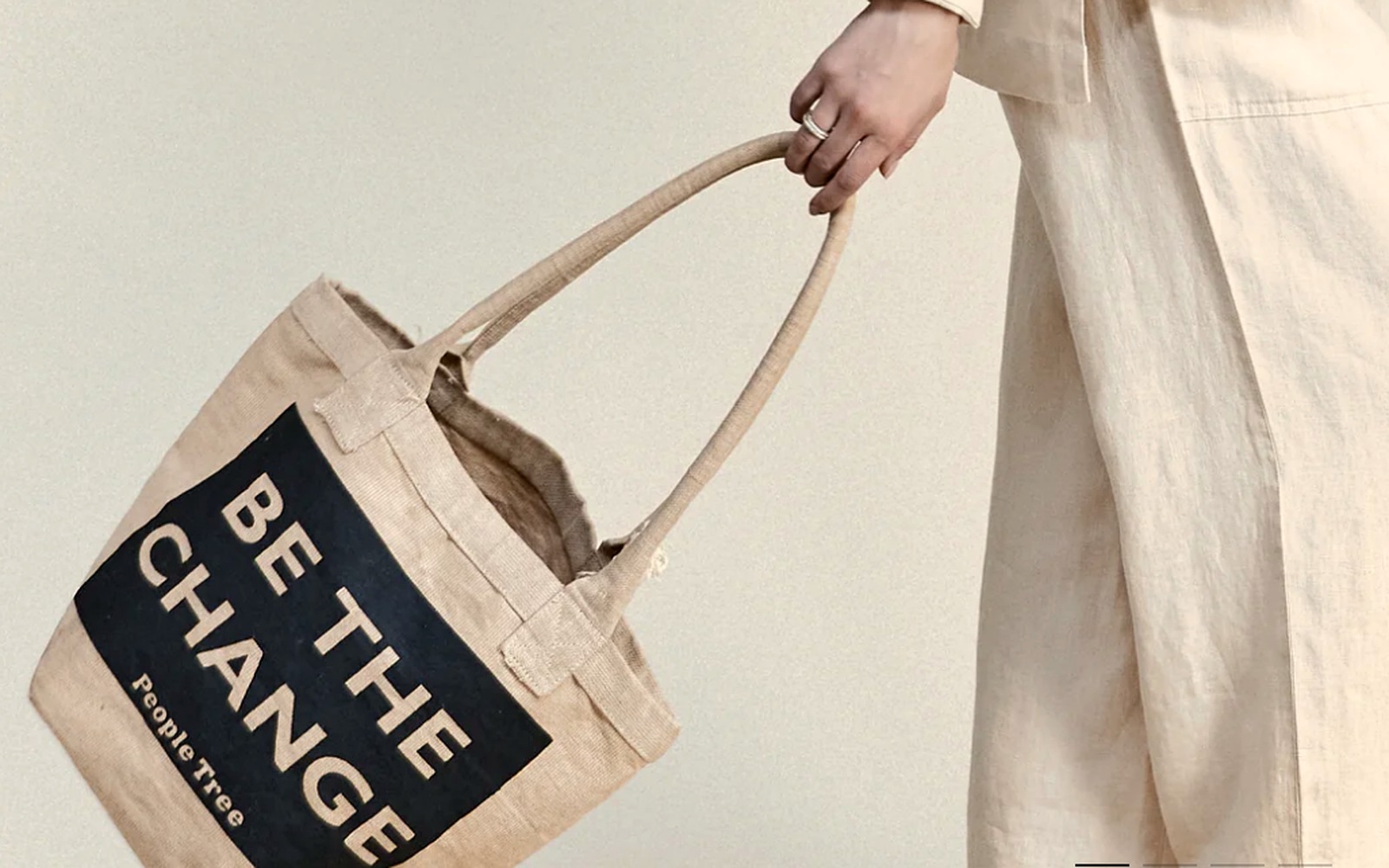 People Tree 'Be the change' fair-trade jute tote carried with the brand's organic linen separates