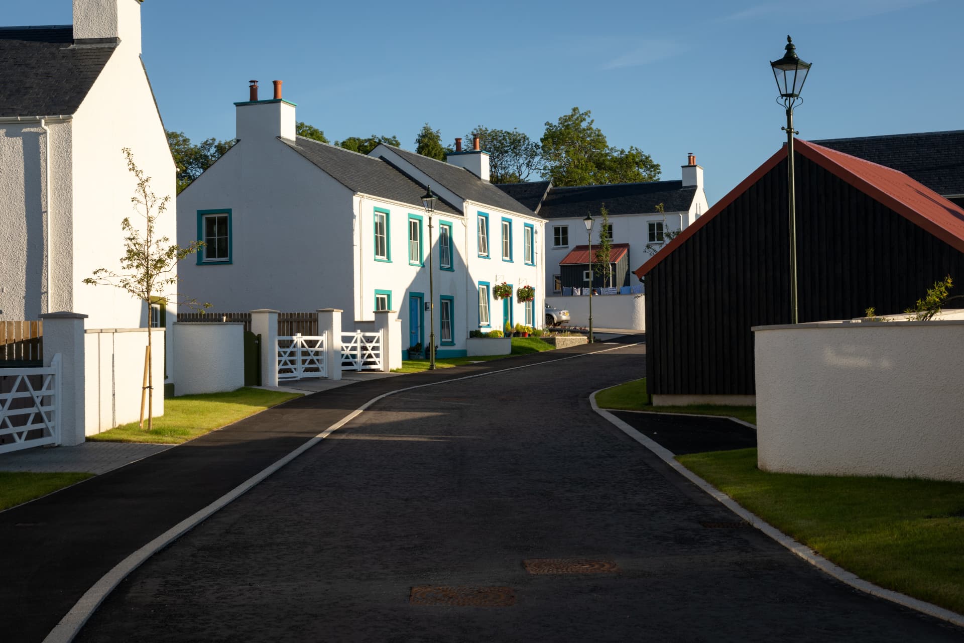 A Tornagrain street of new stone buildings and shopfronts in the Highlands